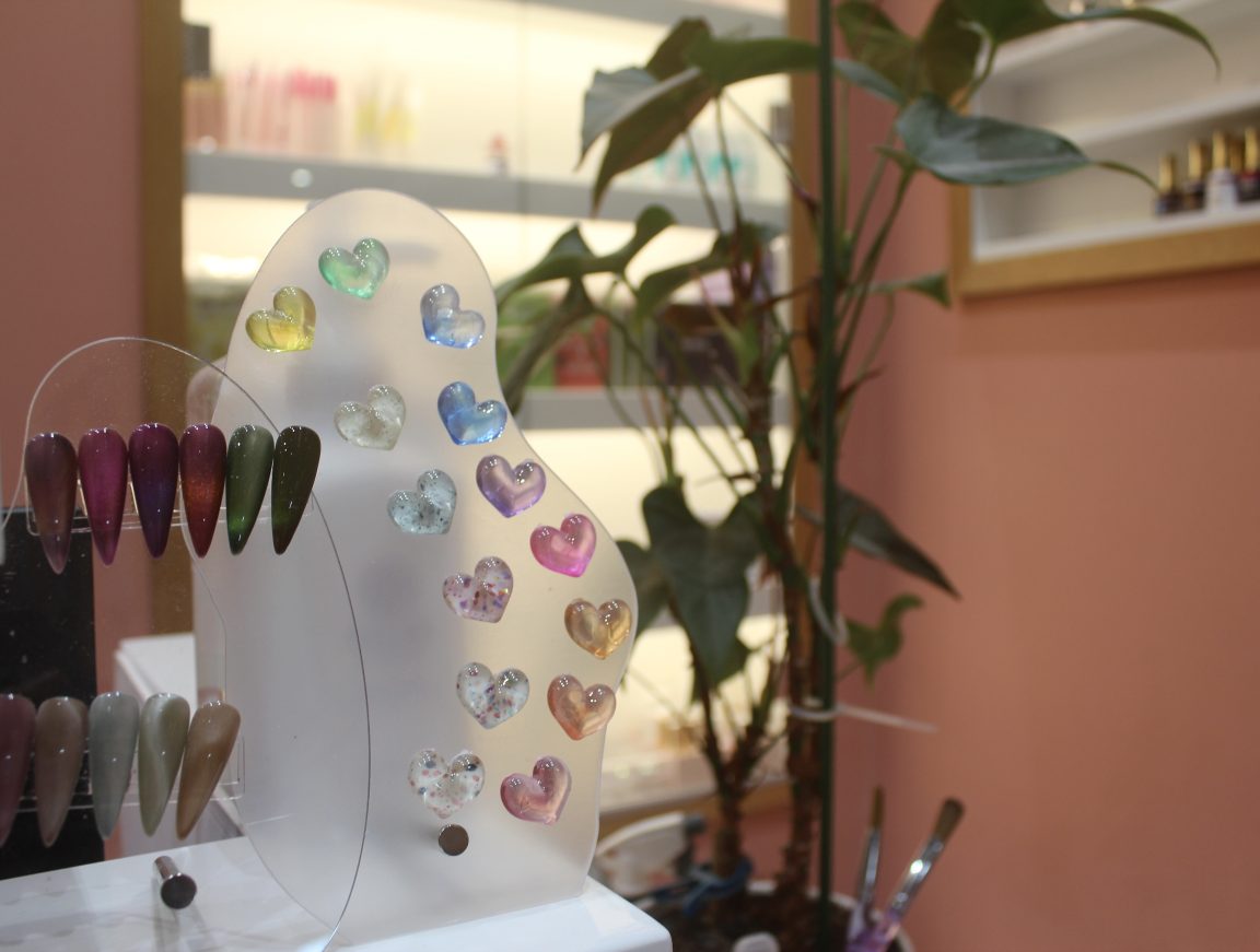 A close-up image of sample nail colours and designs
